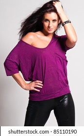 Beautiful Tall Brunette In A Purple Tee And Black Leather Pants