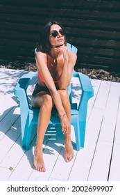 Beautiful Tanned Fit Slender Woman In Bikini In Backyard  Posing On Chair, Summer Vibes