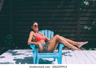 Beautiful Tanned Fit Slender Woman In Bikini In Backyard  Posing On Chair, Summer Vibes