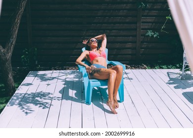 Beautiful Tanned Fit Slender Woman In Bikini In Backyard  Posing On Chair, Summer Vibes