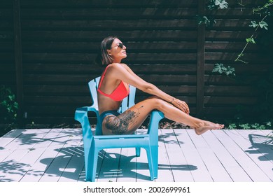 Beautiful Tanned Fit Slender Woman In Bikini In Backyard  Posing On Chair, Summer Vibes