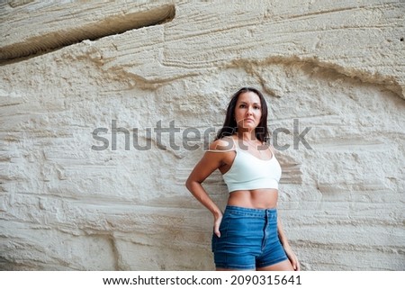 Similar – Brunette surfer woman with top and bikini holding surfboard