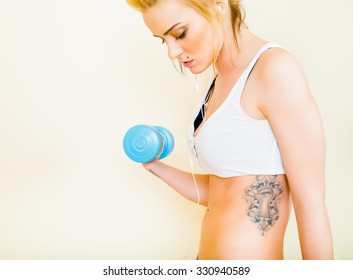 Beautiful Tatooed Woman Doing Her Revitalizing Workout.