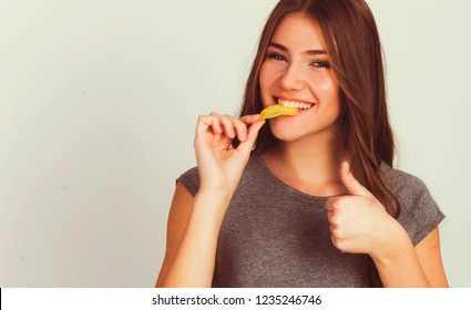 Beautiful Teen Girl Eating Potato Chips Isolated On White Model Caucasian