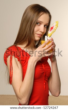 Young woman using smartphone at home with carved wood backdrop