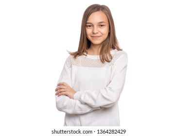 Beautiful Teen Girl Student With Confident Expression, Keeps Arms Folded. Portrait Of Smiling Teenager Isolated On White Background. Happy Child Looking At Camera.