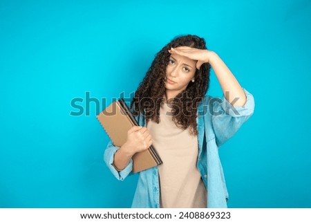 Beautiful teen girl wearing casual clothes having problems, worried and stressed holds hand on forehead.