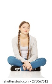 Beautiful Teen Woman Sitting Cross Legged.