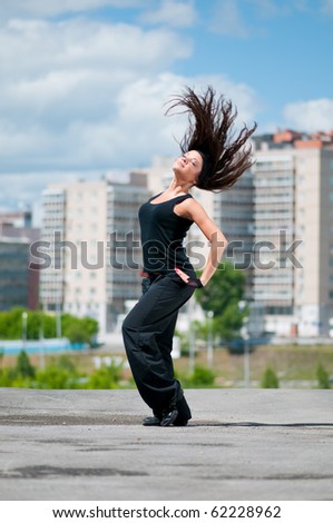 Similar – Young black woman doing stretching after running outdoors