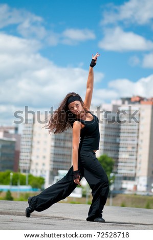 Similar – Young black woman doing stretching after running outdoors