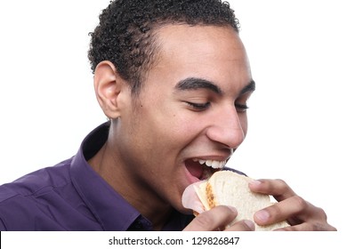 Beautiful teenager eating a sandwich