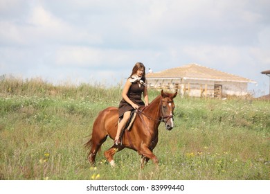 Beautiful teenager girl in brown dress and chestnut horse
