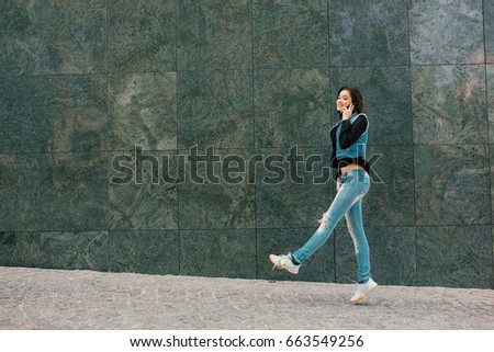 Similar – Image, Stock Photo Happy woman jumping in front of stone wall background