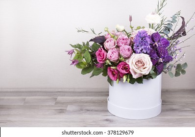 Beautiful tender bouquet of flowers in white box on wooden background with space for text - Powered by Shutterstock