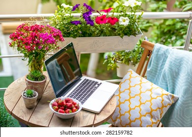 Beautiful Terrace Or Balcony With Small Table, Chair And Flowers. Toned Image