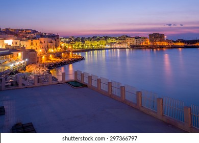 A Beautiful Terrace On The Sea At Sunset In Vieste, Puglia, Italy