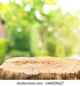 Beautiful Texture Of Old Tree Stump Table Top On Blur Green Garden Farm Background.For Create Product Display Or Design Key Visual Layout.