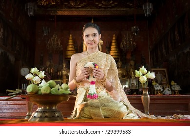  Beautiful Thai girl in traditional dress costume in Choeng Tha as Thailand temple
