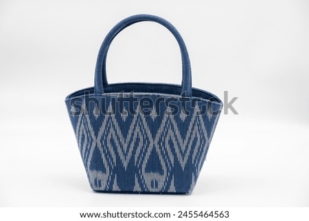 Beautiful Thai pattern silk bag on a white background.