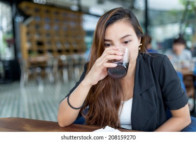 Beautiful Thai Woman Drinking Coke