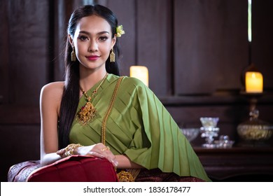 Beautiful Thai Woman In Traditional Costume In Ancient Home