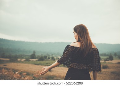 Beautiful Thai Woman Use Hand Touch Flower Grass,very Sad From Unrequited Love,rethink,think Over,vintage Style,dark Tone,broken Heart,asian Girl