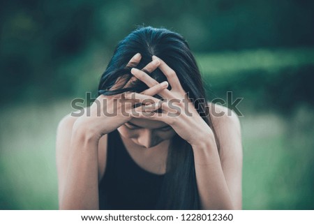 Similar – a desperate woman holding her hands in front of her face