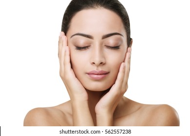Beautiful thoughtful indian girl face with closed eyes, perfect skin make up closeup. Beauty and health care. Ideal portrait of brunette, isolated on white background