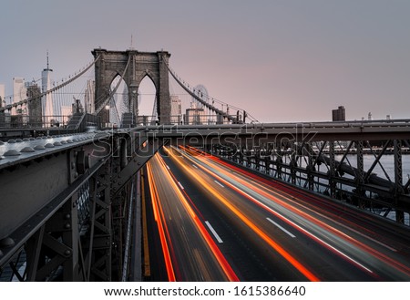A beautiful timelapse shot of car lights near Brooklyn Bridge in New York, USA