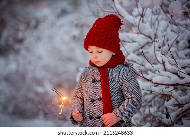 Beautiful Toddler Child, Cute Boy, Playing In Snowy Park Winter Time, Cloudy Day