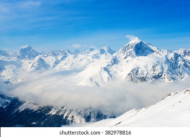 beautiful top veiw of Dombaj mountains with clouds and valley
