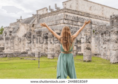 Beautiful tourist woman observing the old pyramid and temple of the castle of the Mayan architecture known as Chichen Itza these are the ruins of this ancient pre-columbian civilization and part of