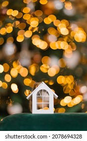 A Beautiful Toy For A Christmas Tree In The Shape Of A House. Real Estate Purchase Concept. Mortgage Realtor Special Holiday Offer. New Year Mood Atmosphere Postcard. Copy Space Place For Text 