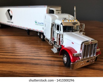 Beautiful Toy Model Freight Flatbed Truck Lying On Office Desk .