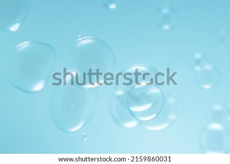 Beautiful Transparent Blue Soap Bubbles Floating in The Air. Soap Sud Bubbles Water	
