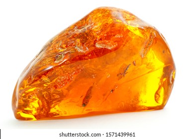 Beautiful Transparent Piece Of Amber On The White Background. Natural Mineral From Fossilized Ancient Resin Of Wood. Yellow Sun Stone  From Of Pitch. A Piece Of Digging Stone. Magic Drawing. Crystal