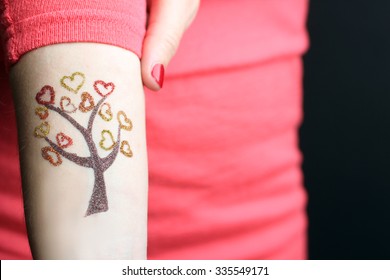 Beautiful Tree With Hearts Tattoo On Girl's Hand