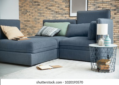 Beautiful trendy room interior with comfortable sofa - Powered by Shutterstock