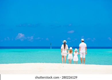 Beautiful Tropical Beach Landscape With Family In White Enjoying Summer Vacation