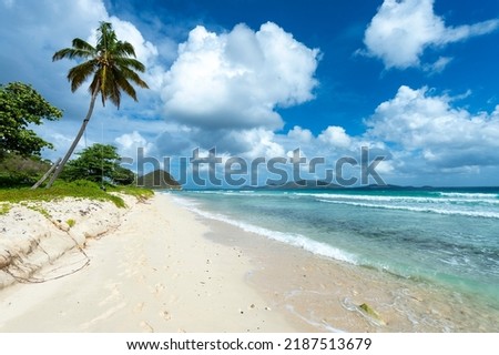Beautiful tropical Long Bay beach on Tortola with views across to Jost Van Dyke on the horizon in the British Virgin Islands