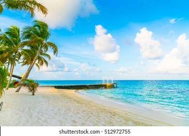 Beautiful tropical Maldives island with white sandy beach and sea - Shutterstock ID 512972755