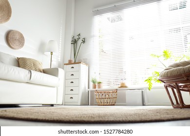 Beautiful tropical plants with green leaves in stylish living room interior, low angle view - Shutterstock ID 1527784280