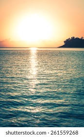 Beautiful tropical sunset ocean background. Vertical filtered shot