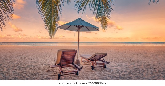 Beautiful Tropical Sunset Scenery, Couple Chairs, Loungers, Umbrella Under Palm Tree. Closeup Sea Sand Sky Horizon, Colorful Twilight Clouds, Relax Tranquil Vacation Landscape. Summer Holiday, Idyllic