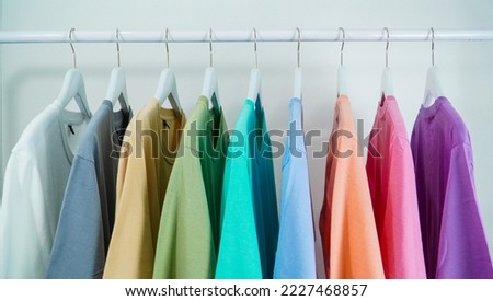Beautiful T-shirt color display on white background on hanger