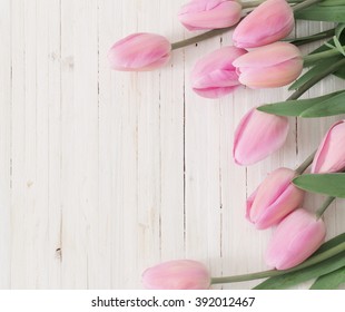 beautiful tulips on wooden background - Shutterstock ID 392012467