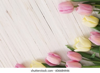 beautiful tulips on wooden background - Shutterstock ID 606684446