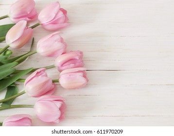 beautiful tulips on wooden background - Shutterstock ID 611970209