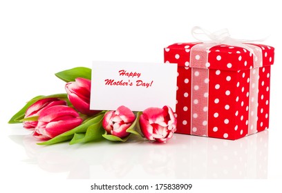 beautiful tulips with red polka-dot gift box. happy mothers day, romantic still life, fresh flowers - Powered by Shutterstock