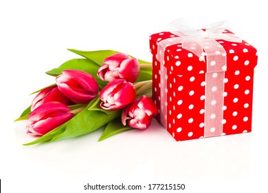 beautiful tulips with red polka-dot gift box. happy mothers day, romantic still life, fresh flowers - Powered by Shutterstock